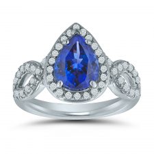 Custom pear-shaped engagement ring with swirling side diamonds